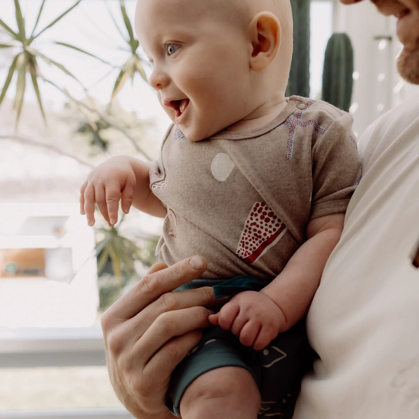 Olive + The Captain: Short Sleeve Bodysuit Shells Brown